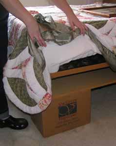 We used boxes of books to raise Elly's bed to give her a "Princess and the Pea" high bed.