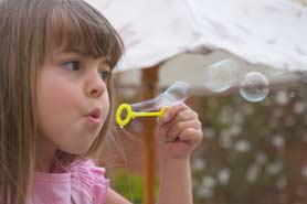 Girl Blowing Bubbles