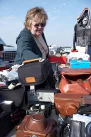 Lady shopping for great deals at a garage sale.