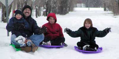 Having a great time sledding!