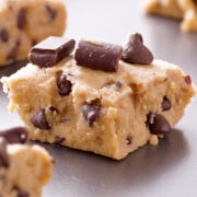 This easy no bake cookie dough cookie bars recipe makes a delicious bar cookie from homemade chocolate chip cookie dough. It's easy to make with only 5 minutes' work and requires no baking!